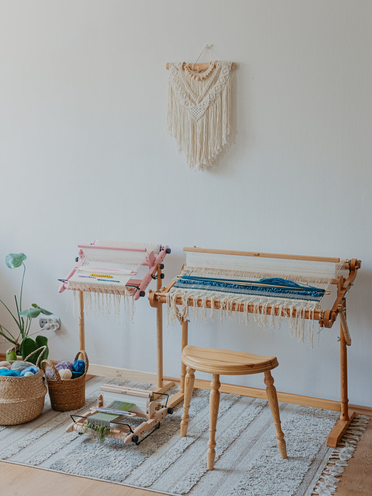 Rigid heddle loom on a stand in a bright room
